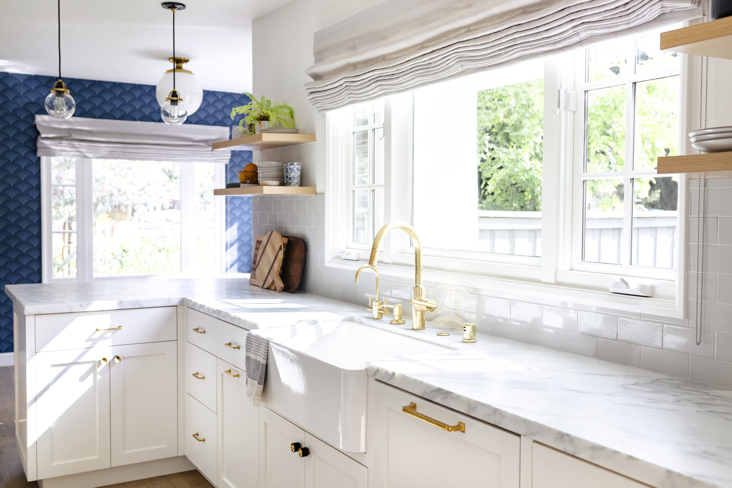 Airy white kitchen with gold hardware